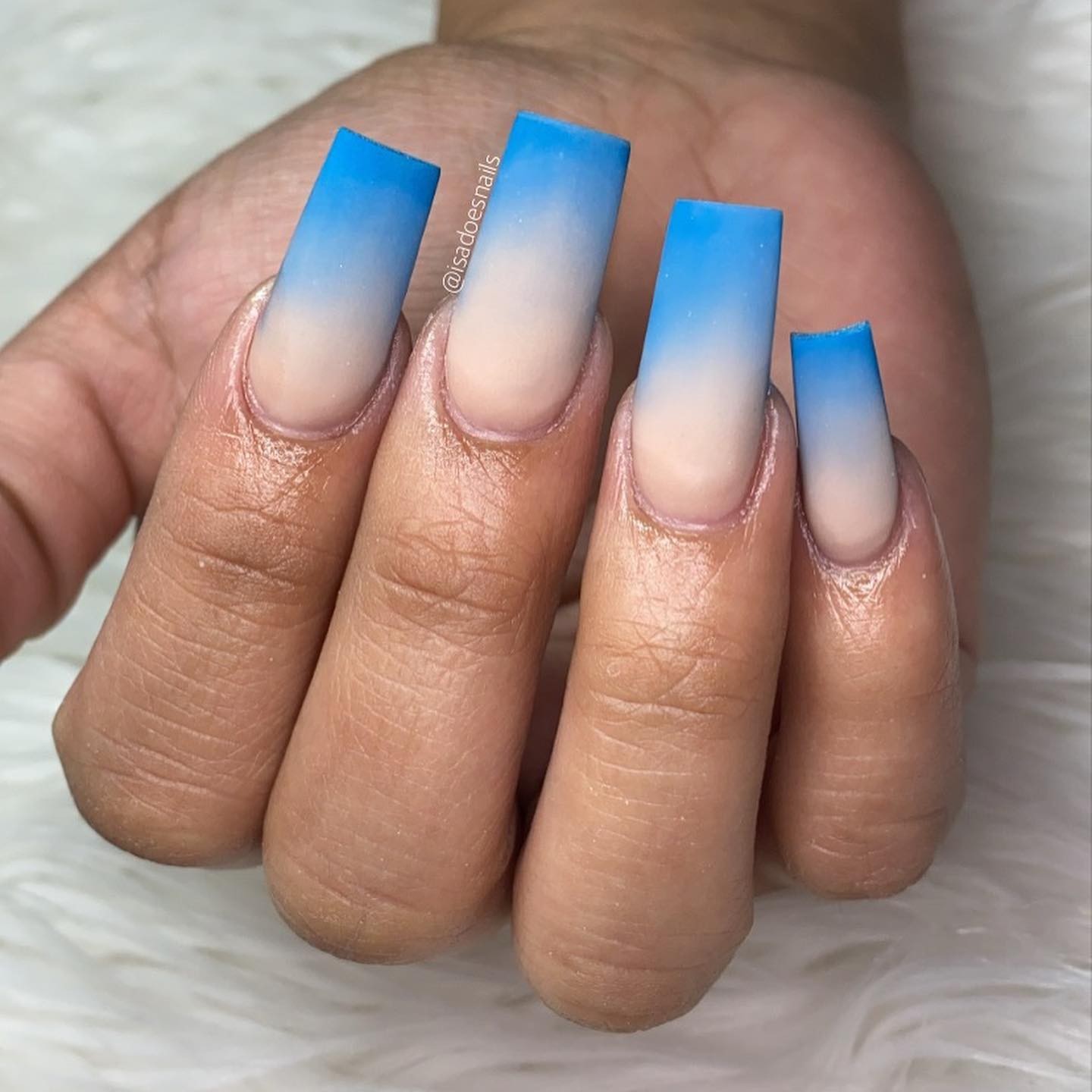 Coffin blue ombré nails such as these will look feminine and attractive for the summer season. Wish to show them off?
