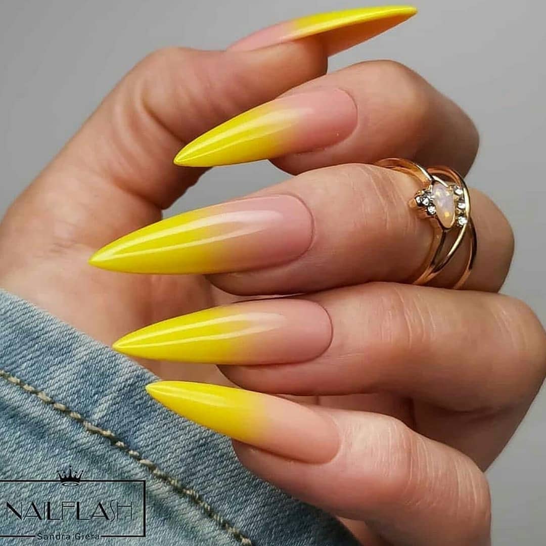 Not a lot of women dare to go this long, bold, fun, and yellow. This gorgeous yellow manicure will suit anyone who enjoys dramatic and attention-seeking nails.