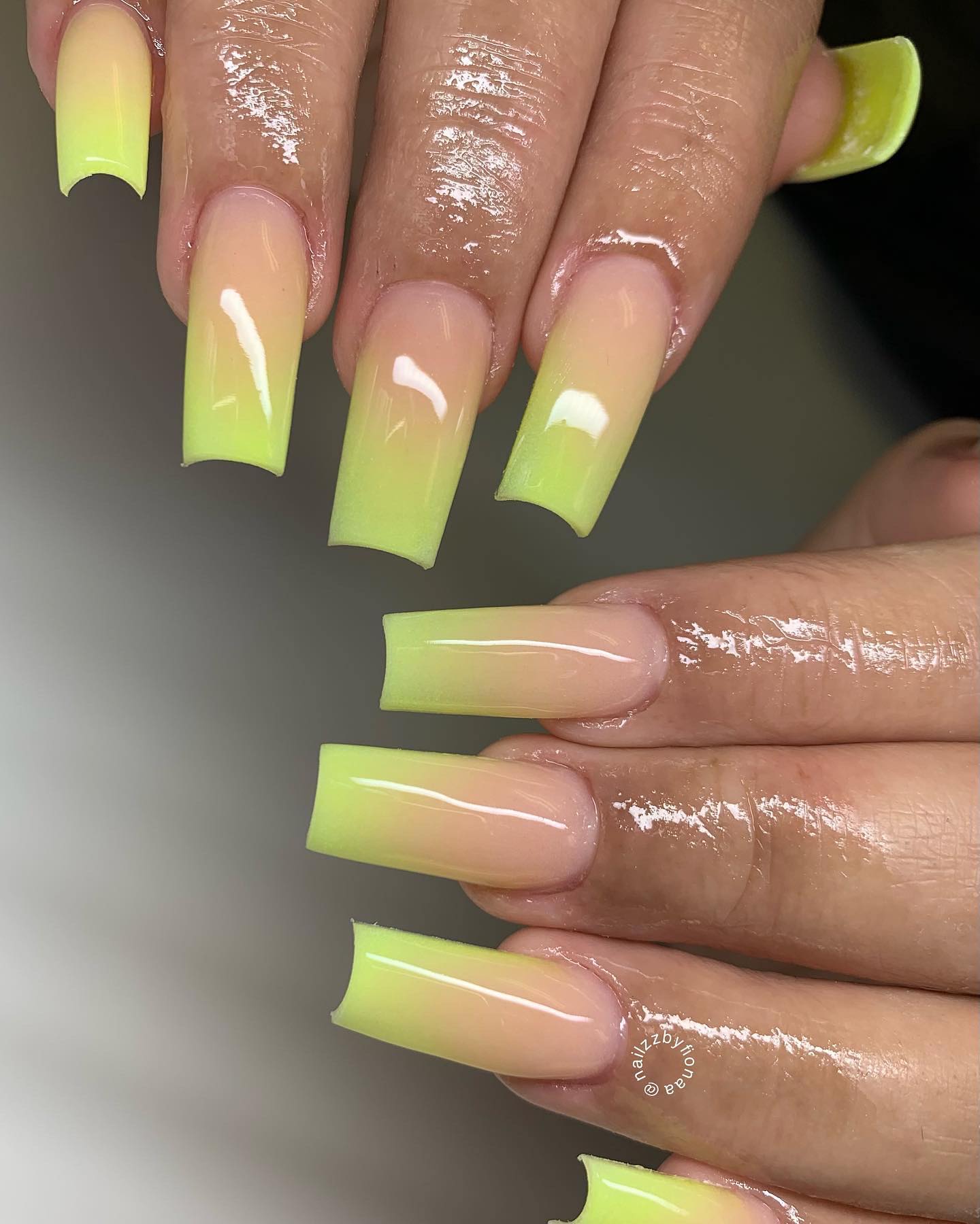 Square yellow and done in this ombré way, this manicure is for women who like neat and clean lines.