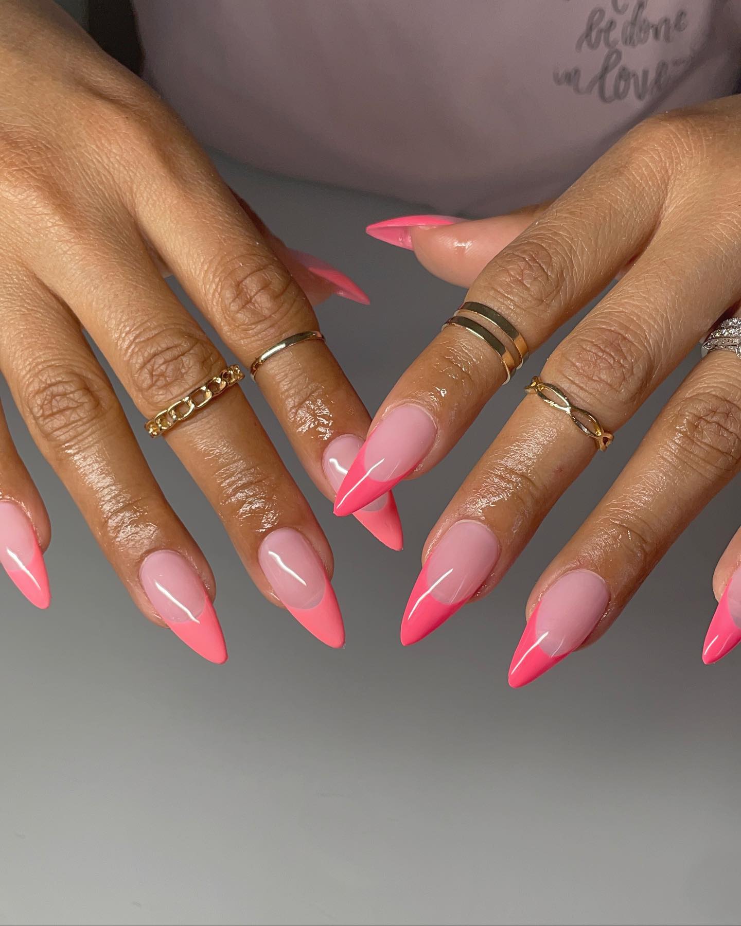 Classic oval pink manicure but with a loud undertone. This design is for party women who like to stand out.