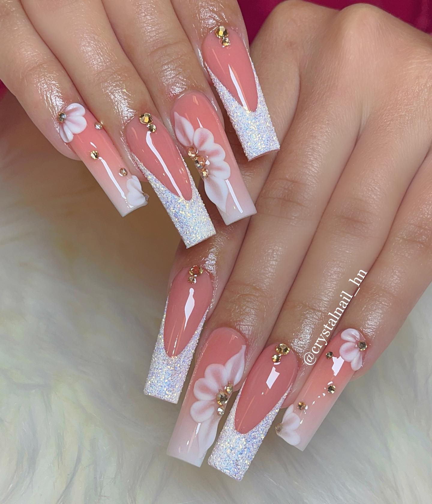 Women who plan on getting married sometime soon might fancy this manicure the most. It is a gorgeous bold French design that is decorated with flowers and giant gemstones which you will enjoy for those glamorous moments.
