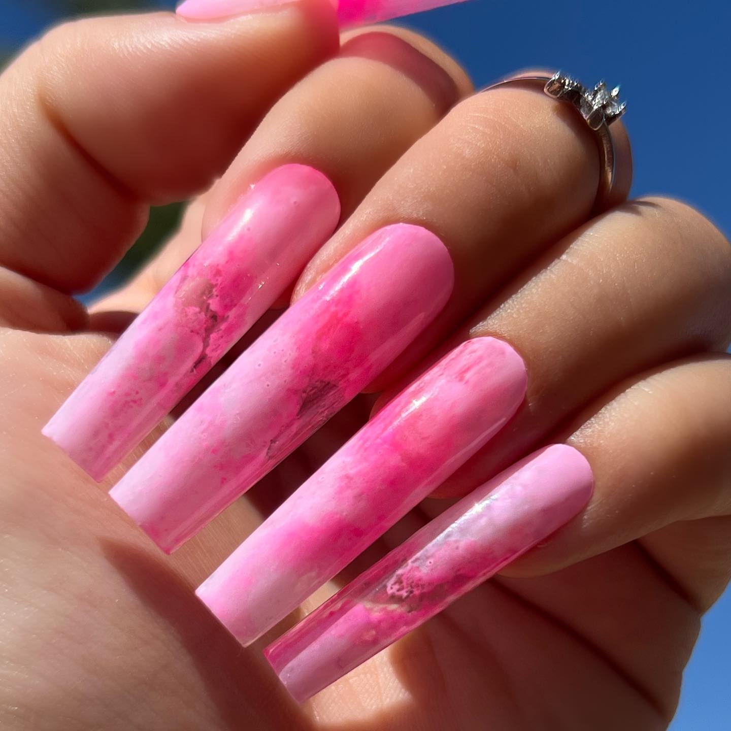 Bright pink and feminine acrylics such as these will look amazing on young women and those who fancy longer nails.