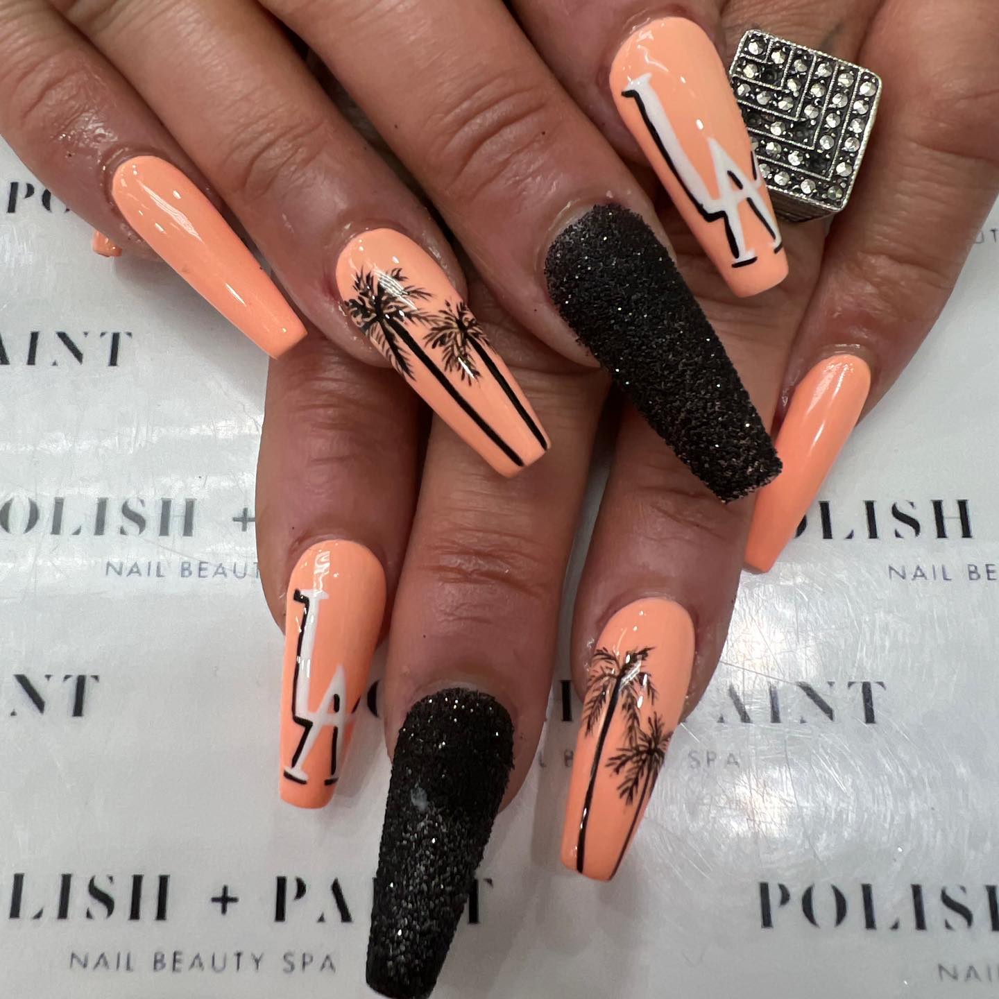 Coral and black nails such as these will look feminine and party perfect. Show them off and know that not a lot of women will have something similar.