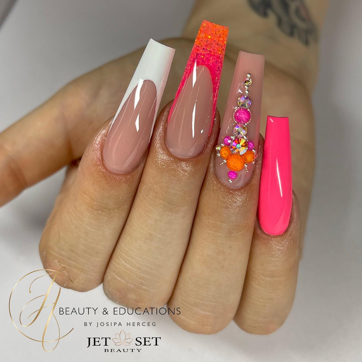 Long bright pink and done in all these shades of pink will suit women who enjoy elegant acrylic nails. Show them off only if you fully trust your nail tech.