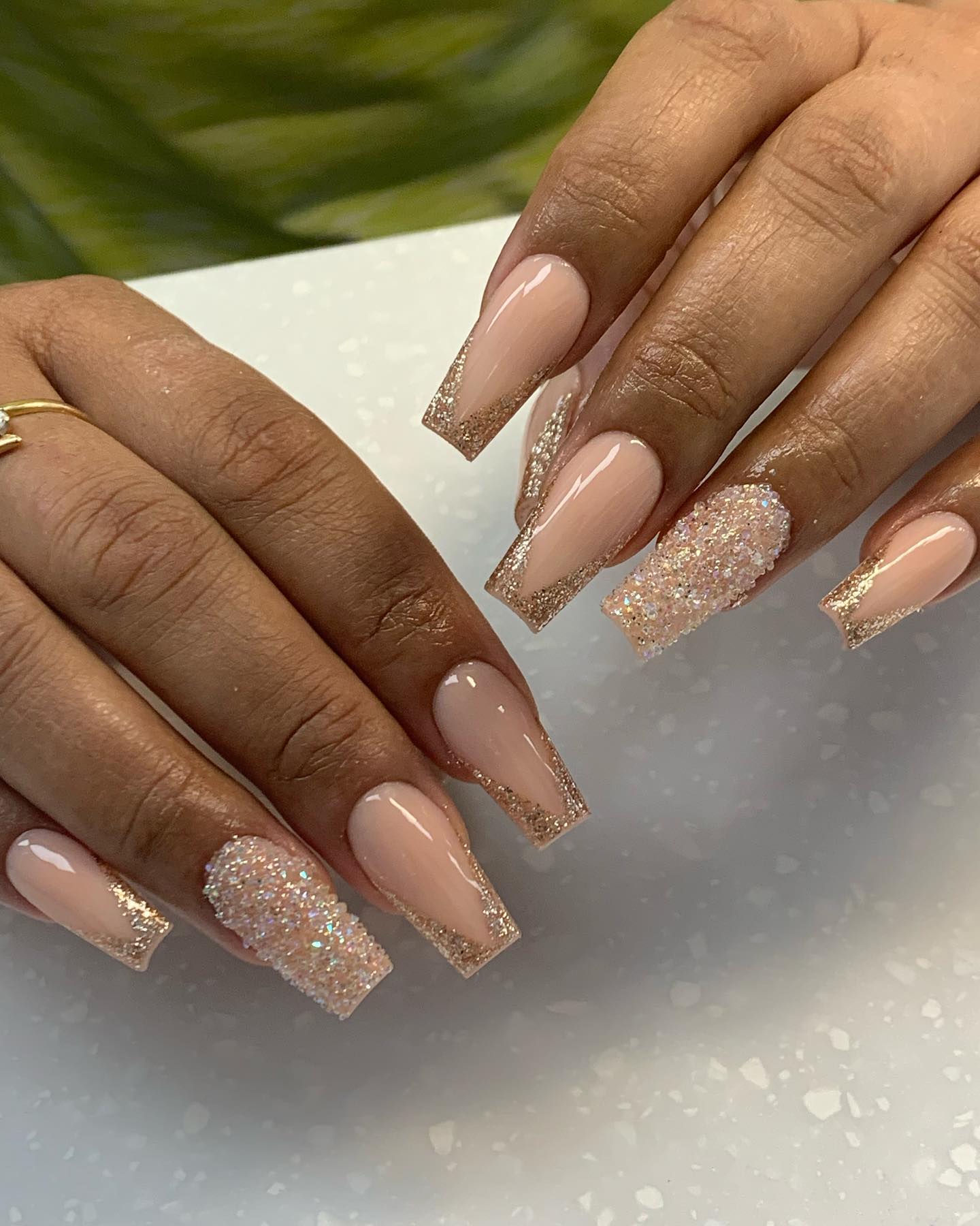 Cute glitter and nude nails such as these will look the best on women who enjoy elegance and nude shades.