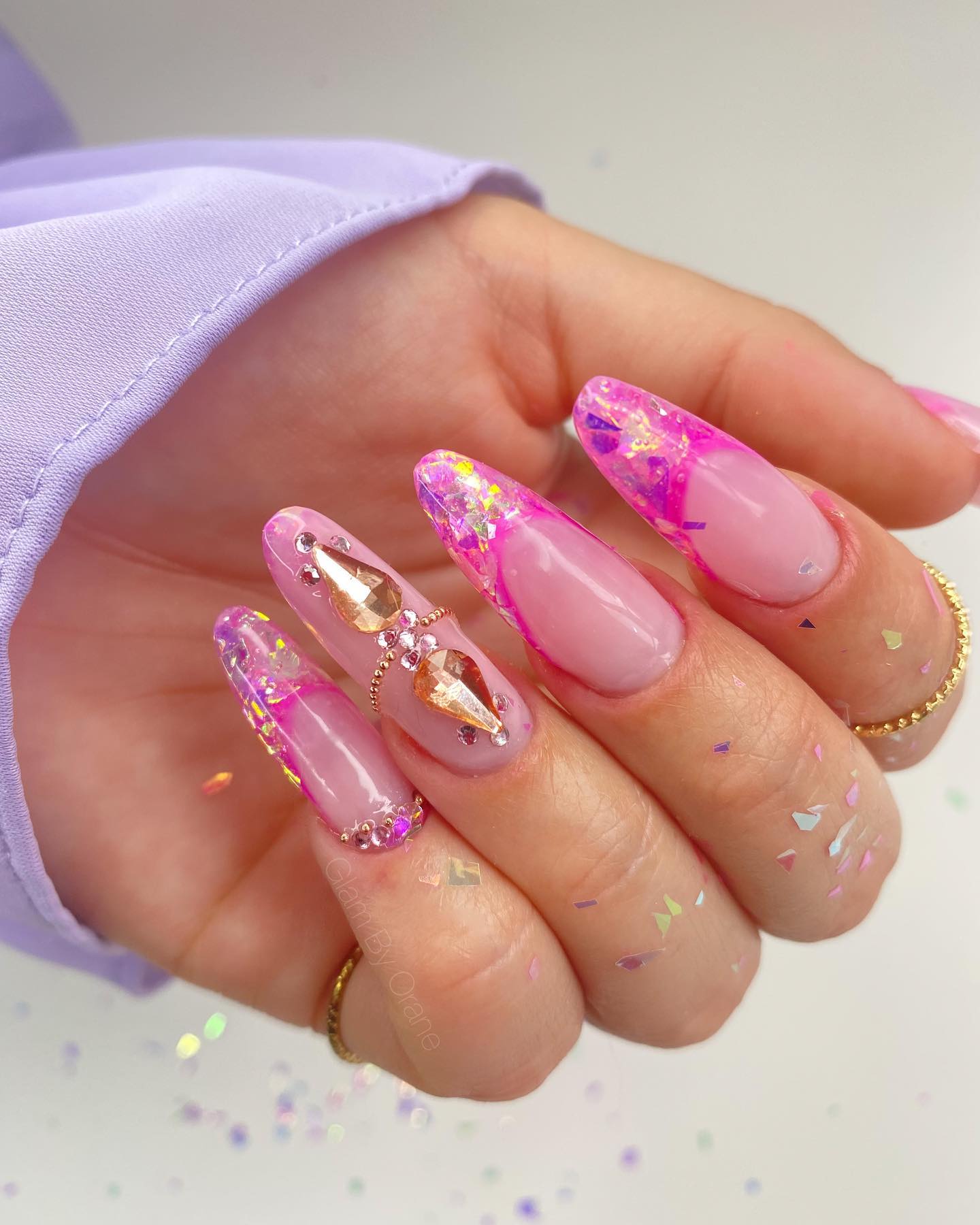 If you like gemstones and glitter this manicure will suit you. Show that you know how to rock bling oval nails and that pink is your favorite shade as well.