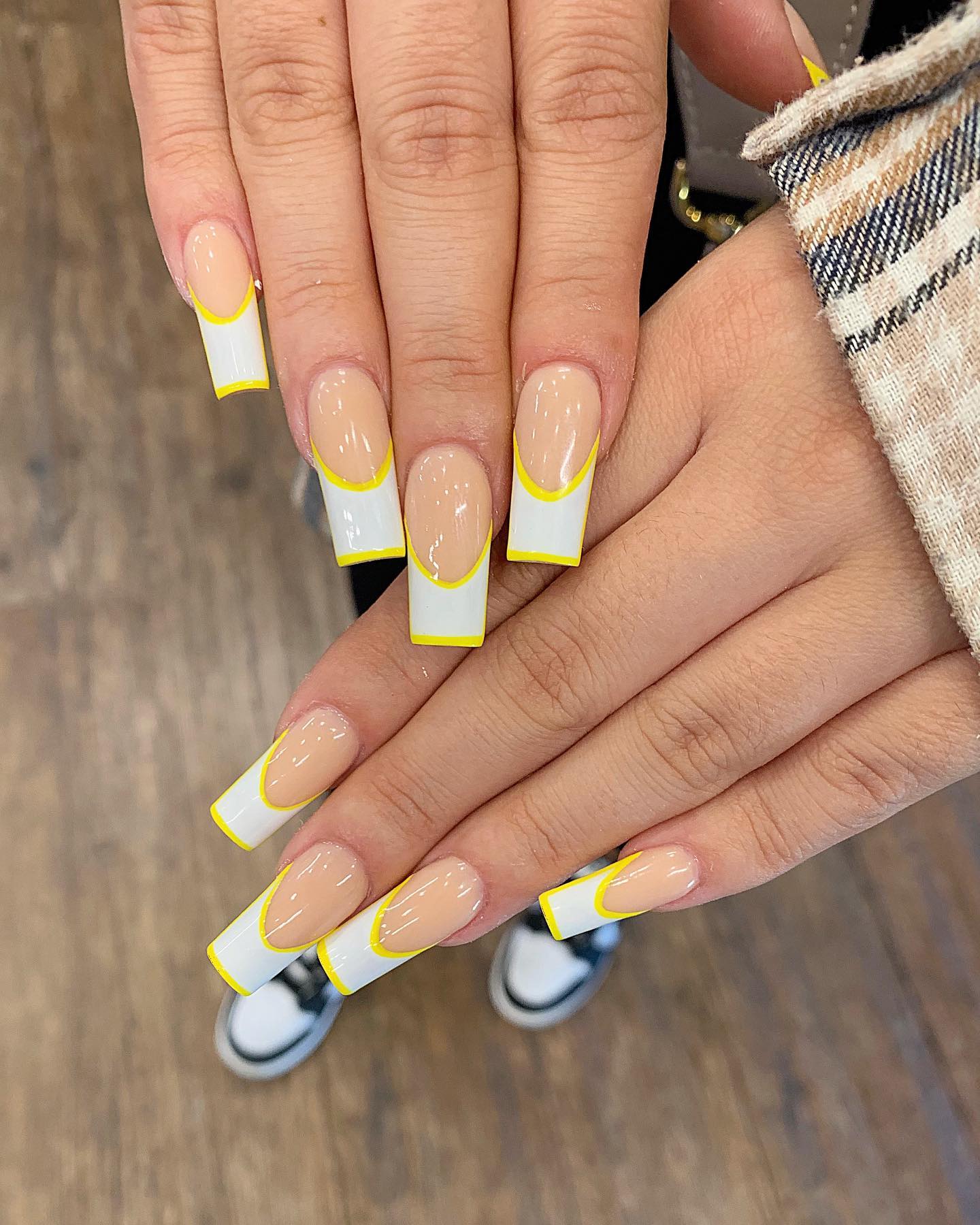 How about this take on French nails? Yellow and white are the best summer colors to consider and try out this summer season!
