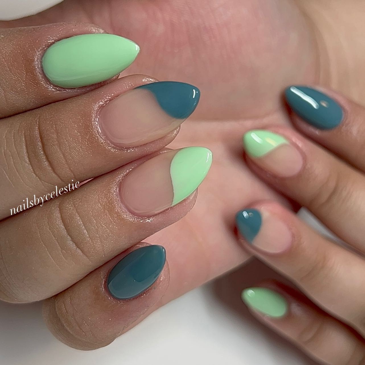 A pop of green with a subtle grey hue seems like your best go-to move. Try out these nails if you’re a fan of nail art and geometrical shapes.