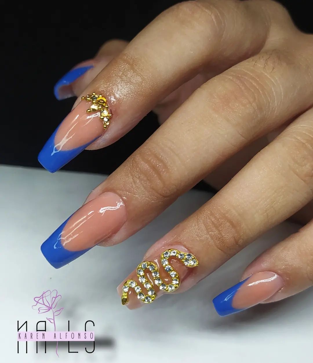 Blue French nail tips with a pop of gold are common and popular nails for the prom! If you like elegance this combo will suit you.