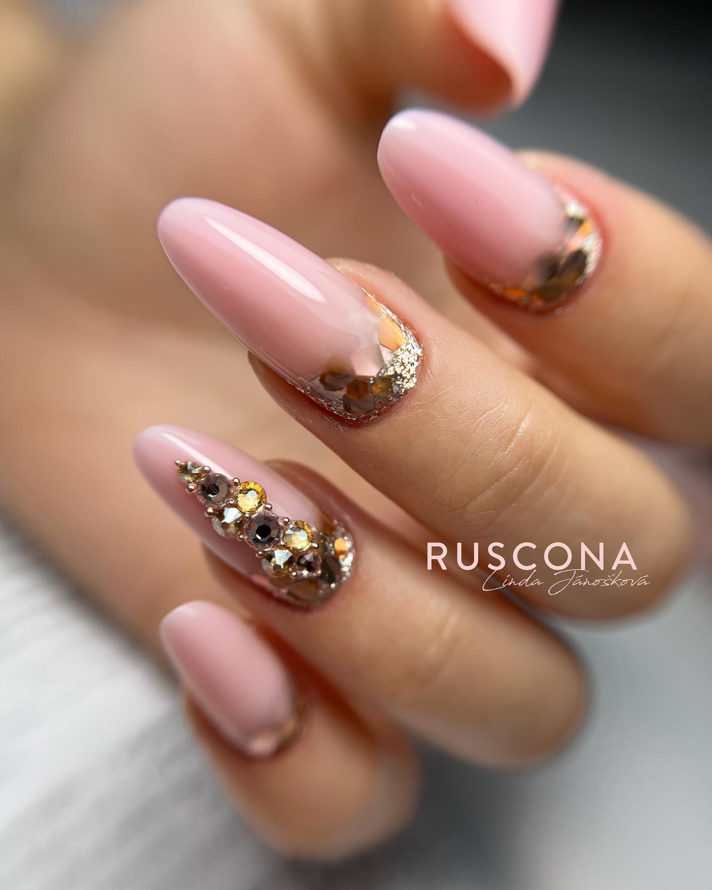 Nude shades and this gemstone detail will look feminine and dramatic. Show this mani off for formal events where you wish to fully shine!