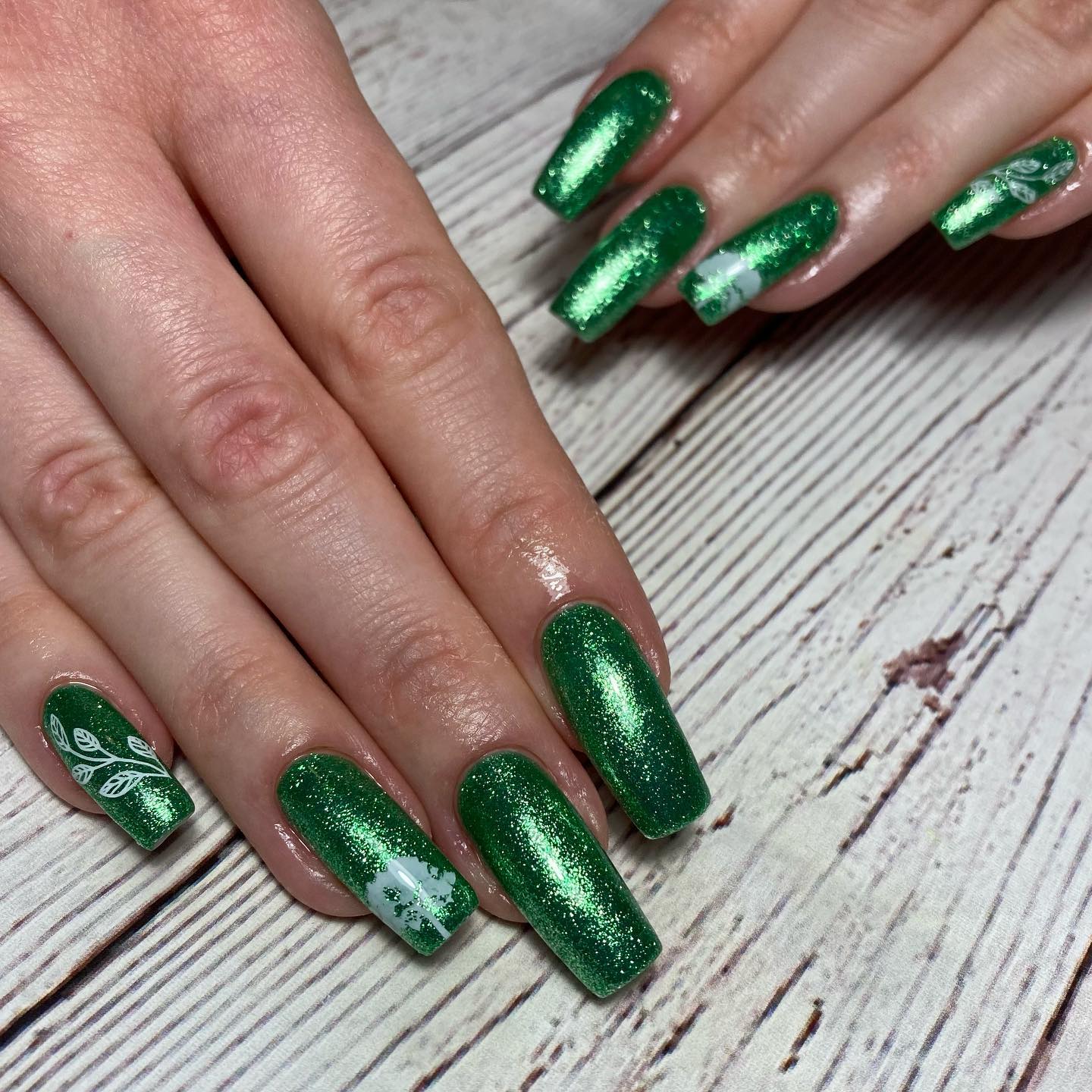 Here is a great idea for parties. You can shine up the night with your dark green glittered nails.