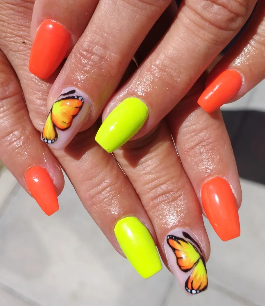 Neon colors are the colors of summer, for sure. As you see, wings of the butterfly are mixture of yellow and orange, so why not using these colors in your other nails?