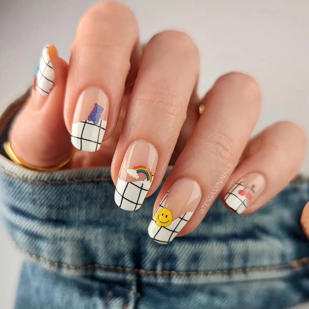 Little emojis on top your nude nail polish is a simple way to achieve a cute look.