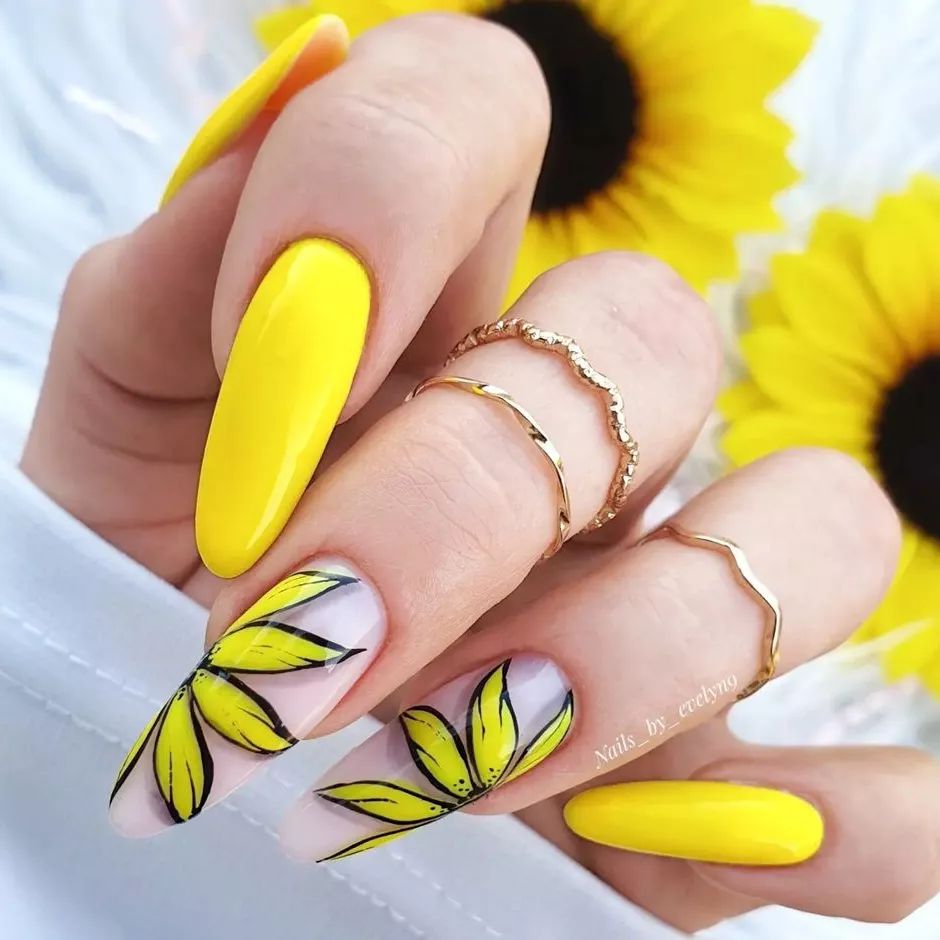 Beautiful sunflowers look gorgeous on top of transparent nails. You should definitely try this.