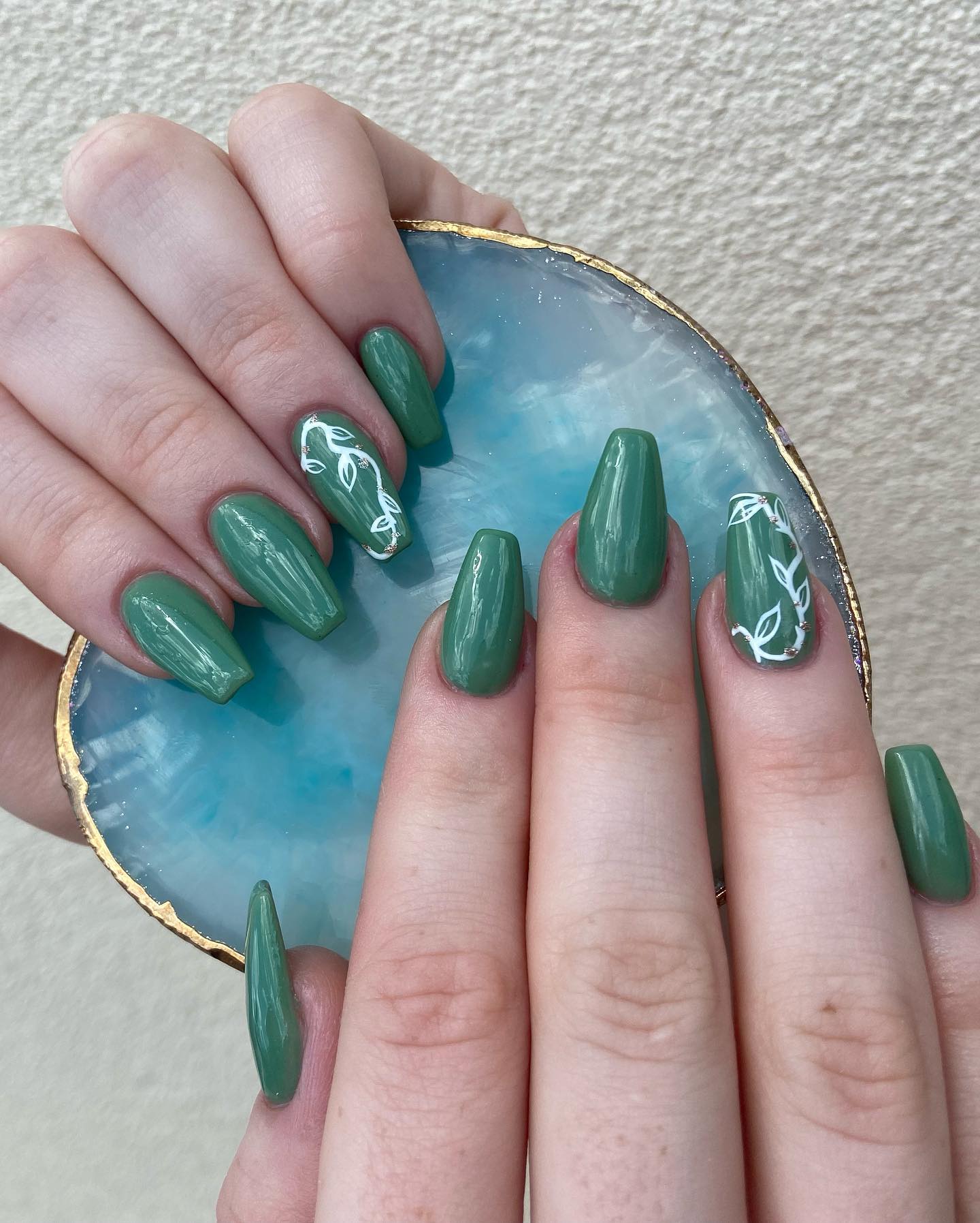 Dark green tones are the perfect choice for winter. This shade of green looks a little bit pastel, too. You should definitely try this in cold winter days.