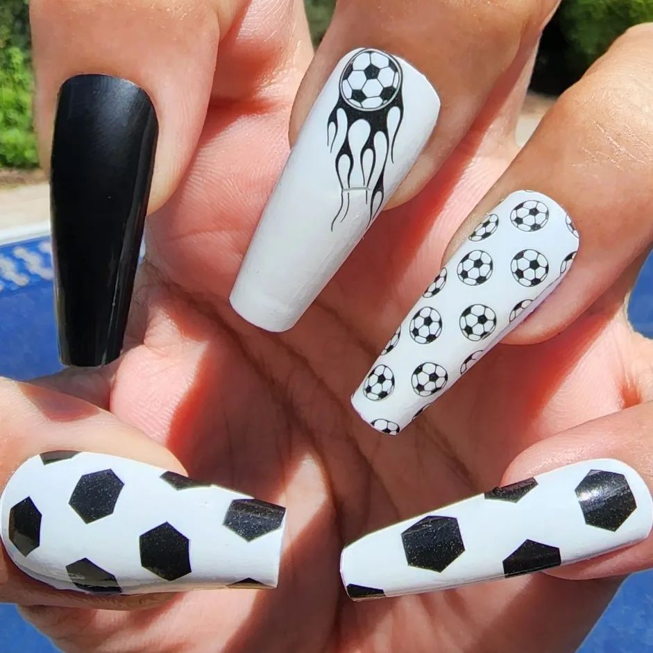 Are you a football lover? Mixing black and white nail polish and using soccer ball is a great idea.