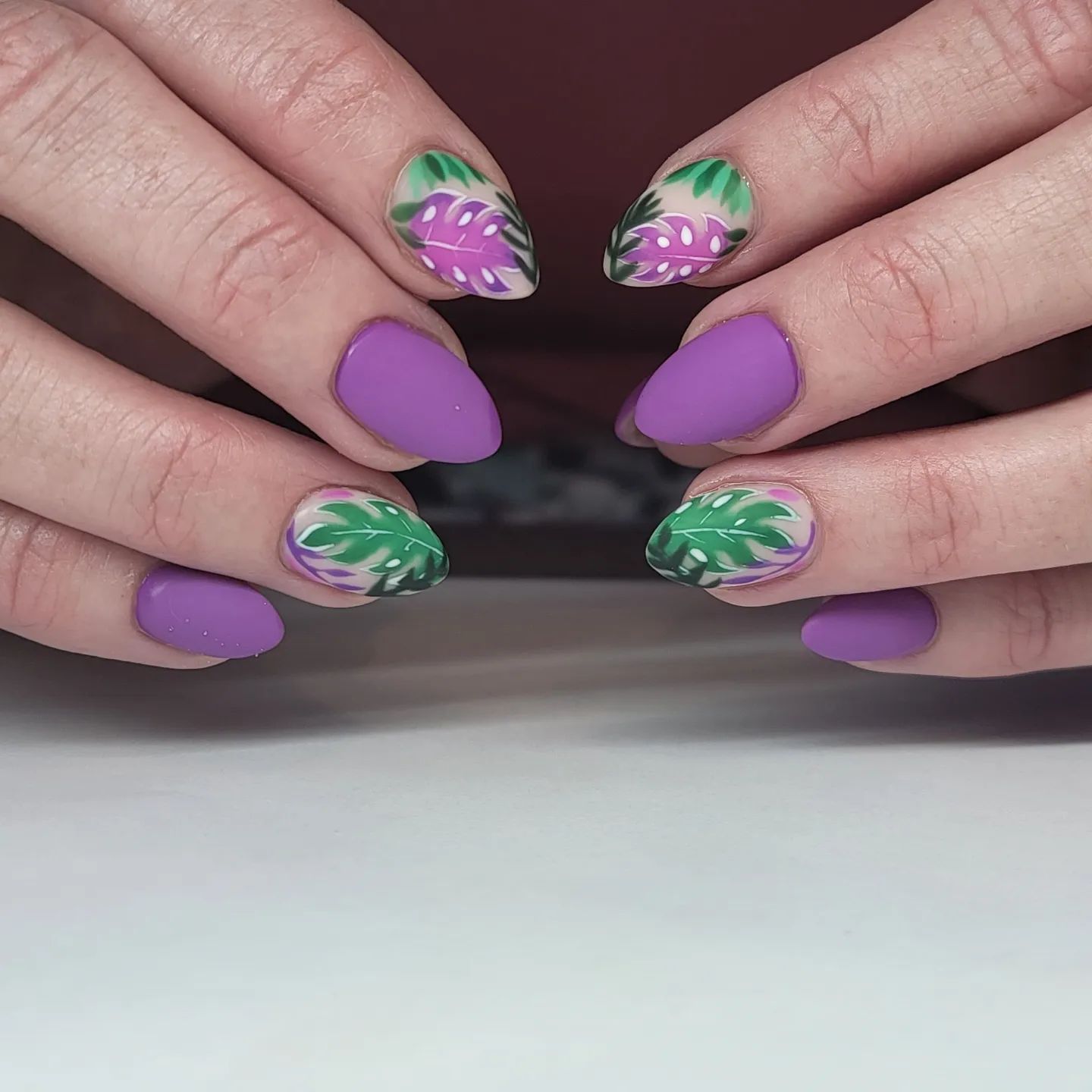  This is for those who love matte look. To give your lilac matte nails an energy, lilac and green leaves accent nails are great.