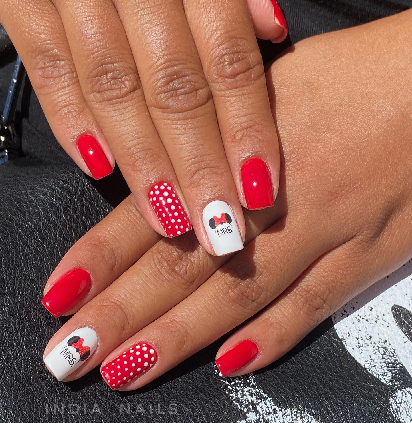 It's sure that there are some Mickey mouse fans. You can combine Mickey with your red nail design.