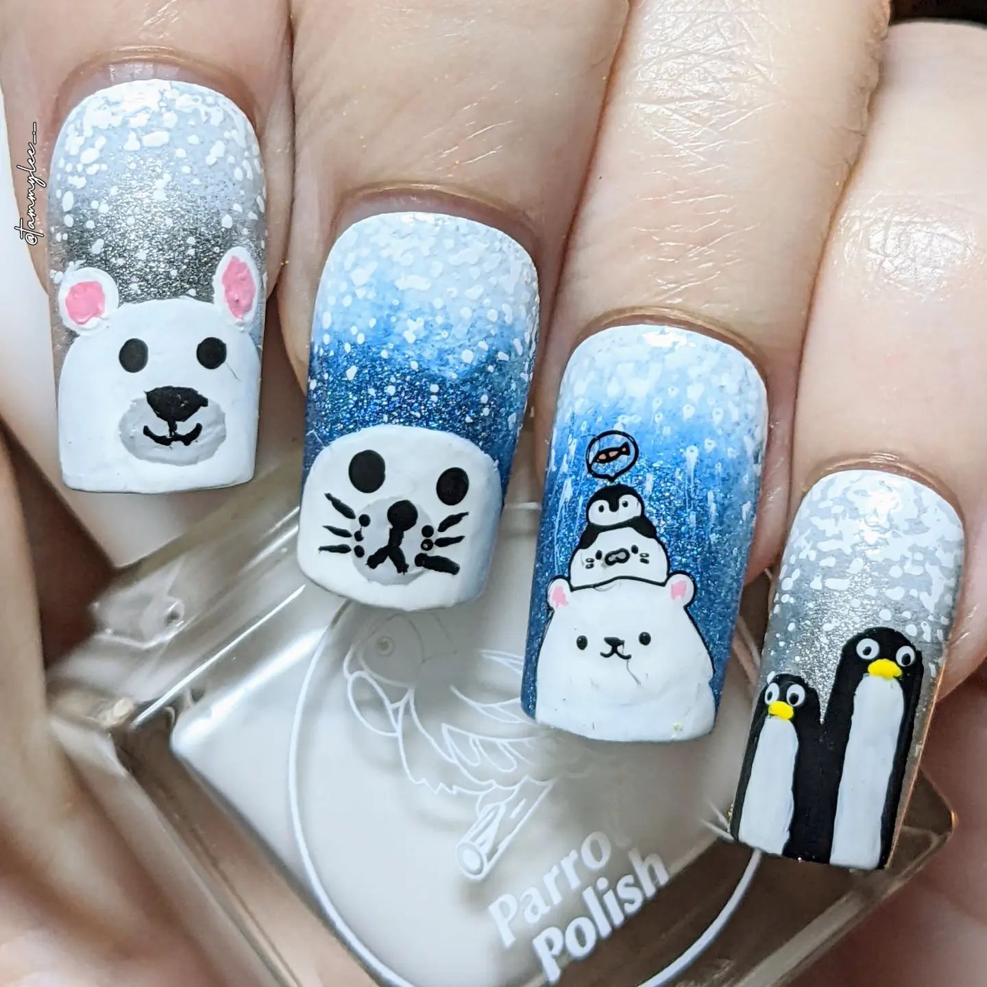 How about having a winter nail art that is full of animal faces? It looks so adorable and you should definitely try it out.