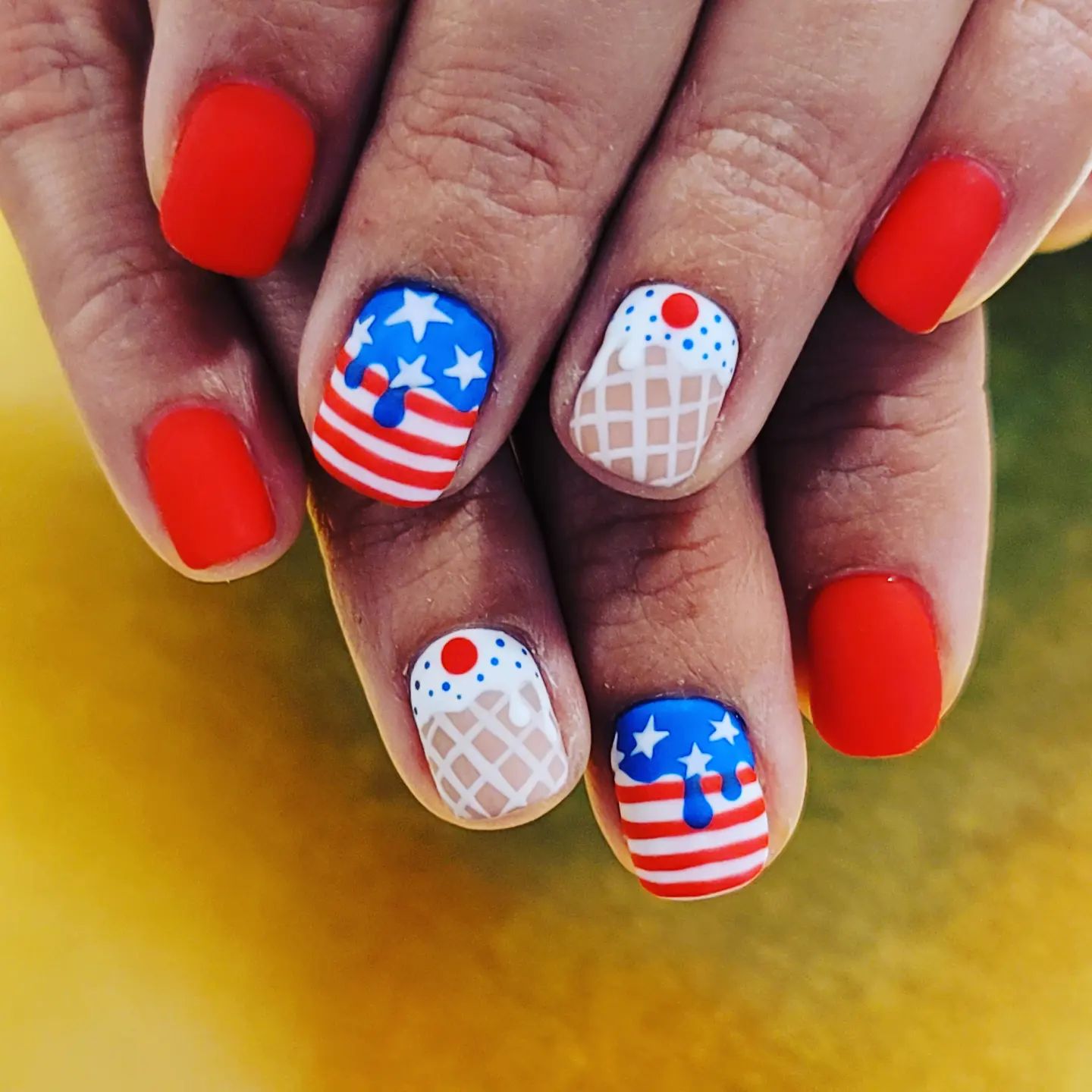  How many people have a melting ice cream and the American flad on their nails? Not many, so if you want to shine out in a crowd, go for it.