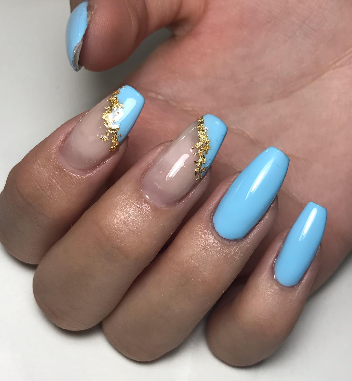 As you see, gold glitters go well with this shade of light blue so much. This cross nail design idea will look amazing on your nails.