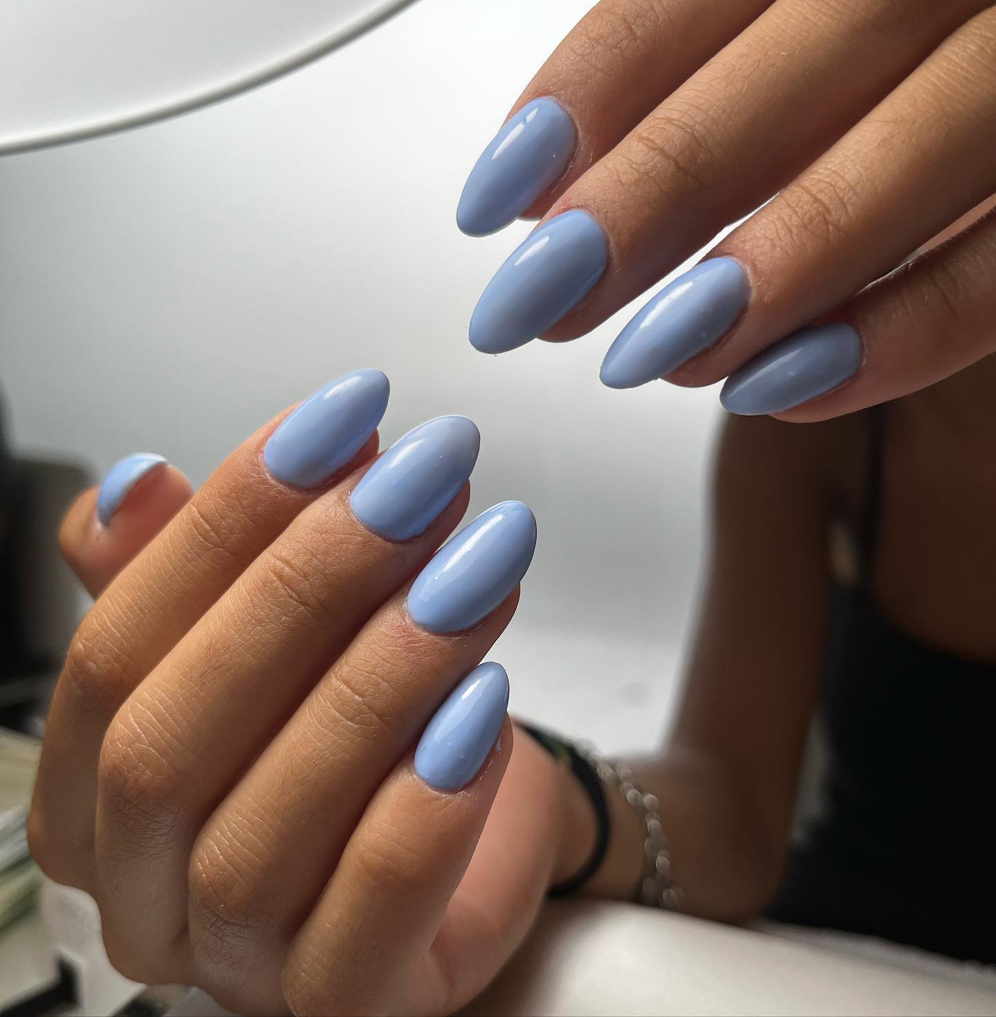 In order to get a simple look, you can try this perfect shade of blue with your almond shape nails.