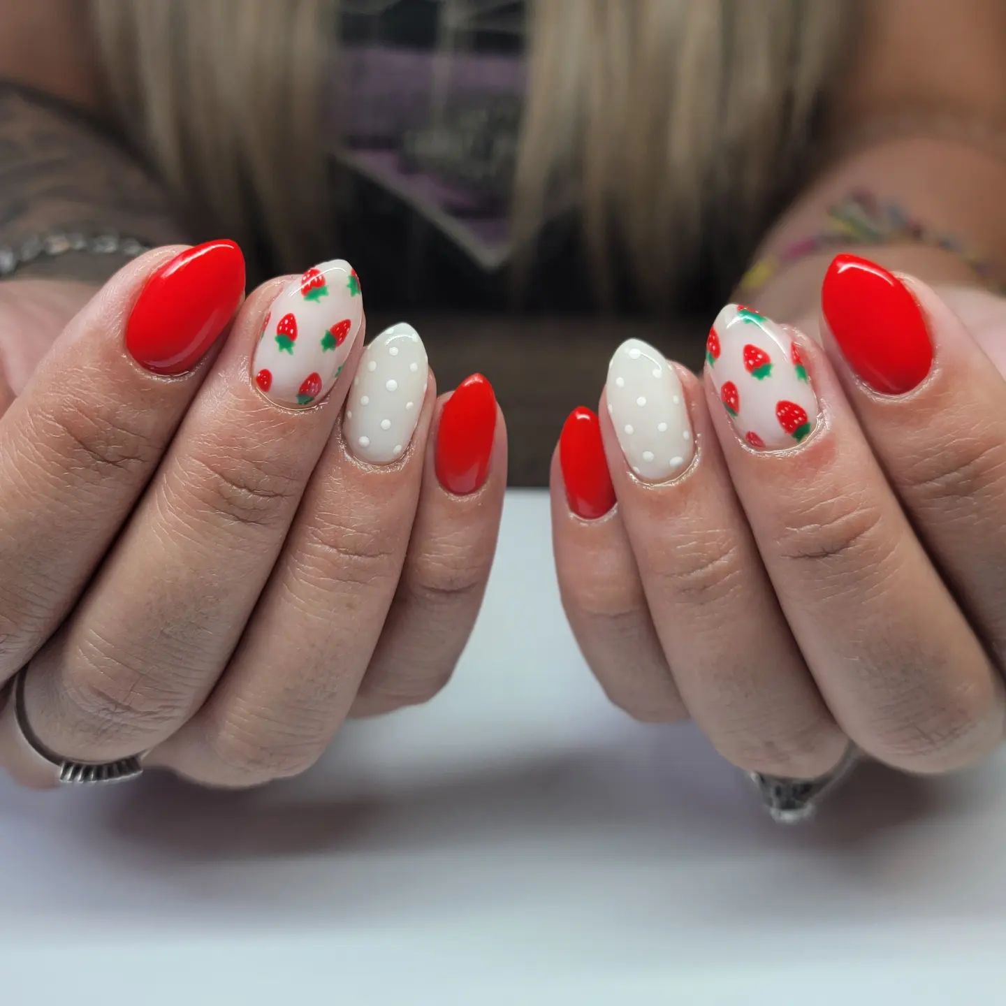The fruit of summer, strawberries! When you wear red nail polish, it is a great idea to make it different by having strawberry accent nails.