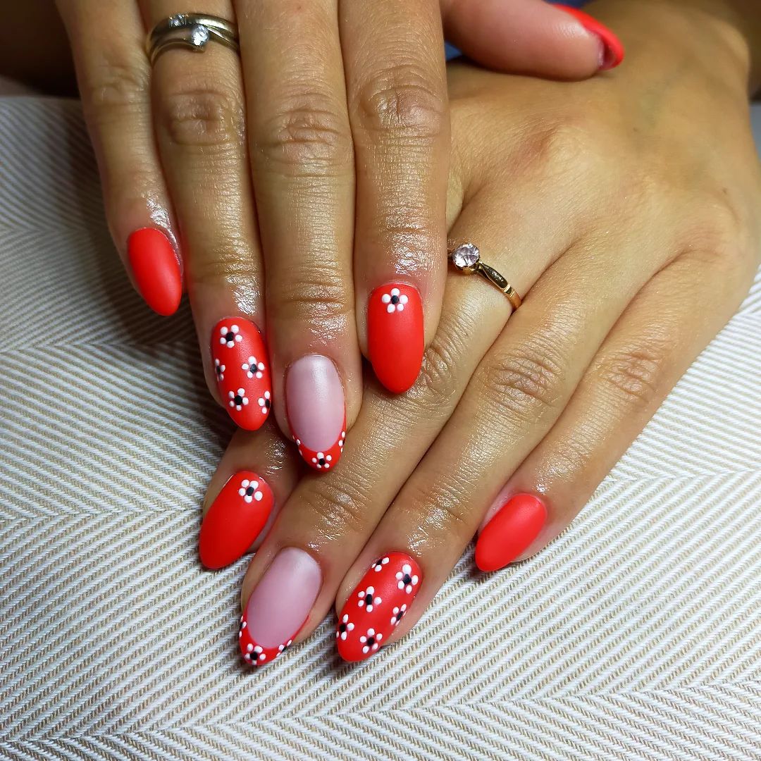 For spring and summer vibes, adding some flowers on your nails is a great choice. This super light red color looks awesome, too.