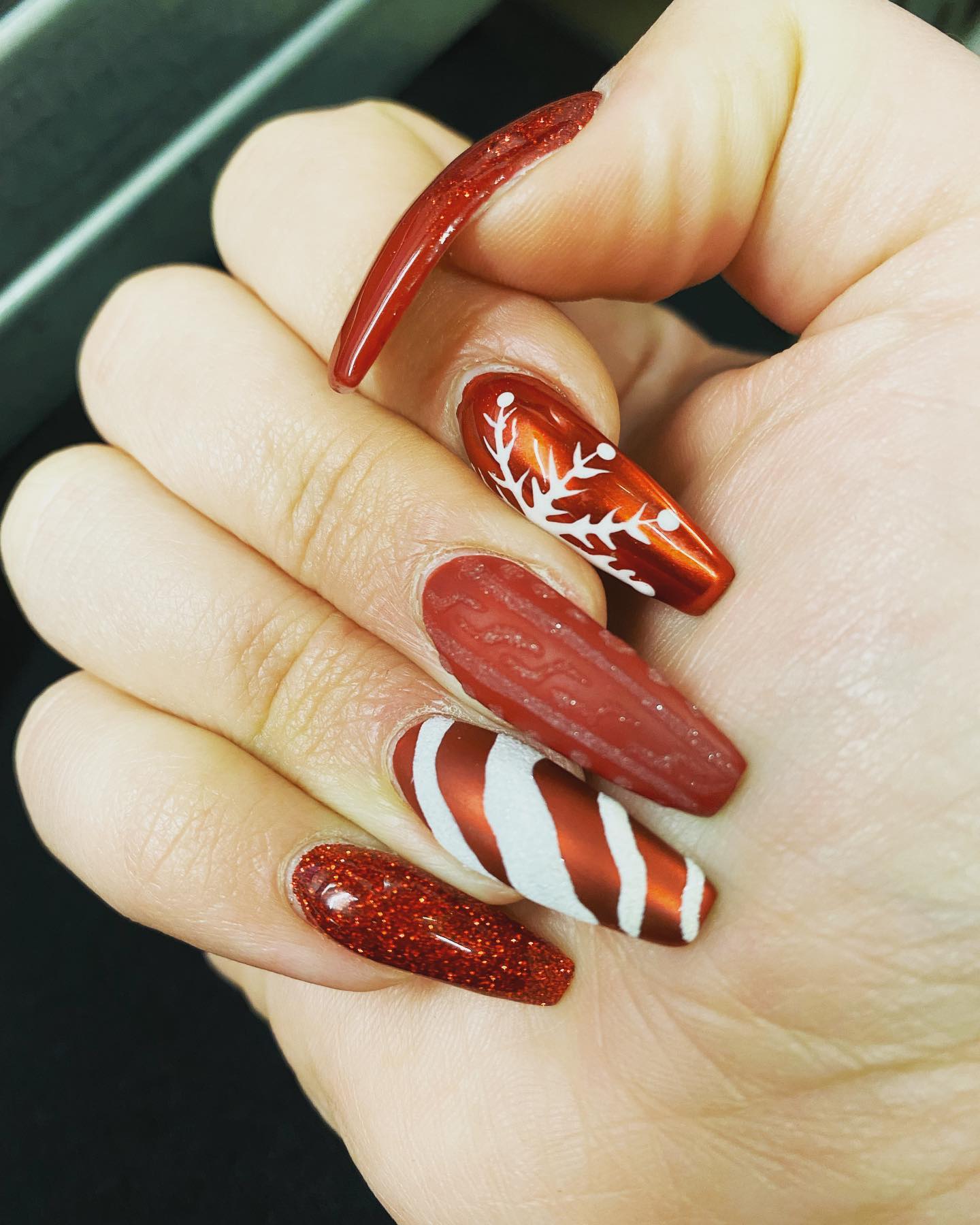 If plain red nails are not for you, the nail design above is for you. You can design all of your fingers with different nail arts.