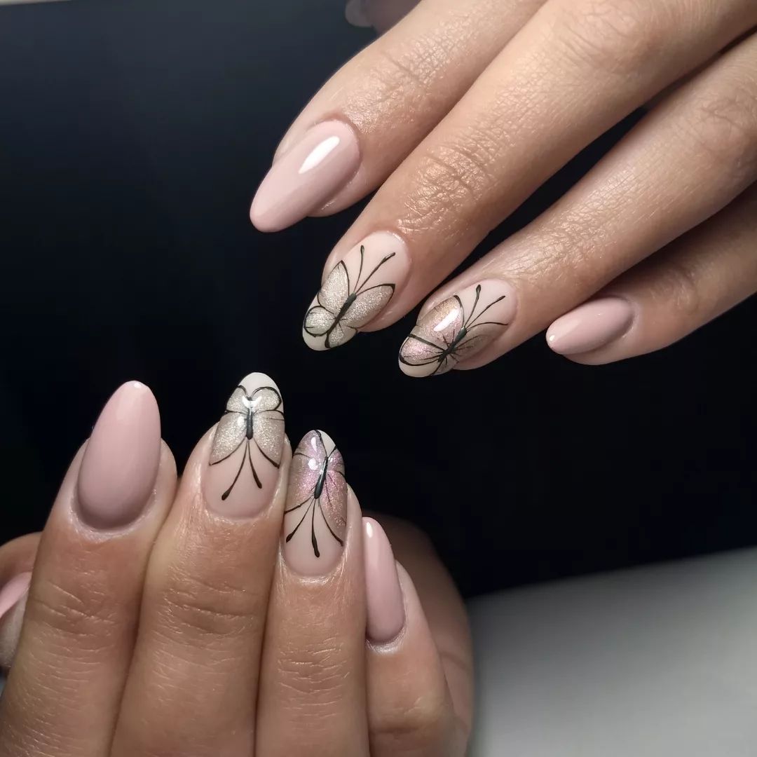 Nude nails look great with some shiny butterflies on them. If you don't like colorful nails, you should give this nail design a shot.