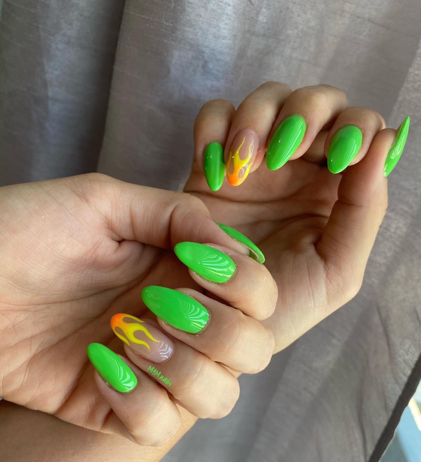 Feeling the summer is easy with those nails. Super bright nails and a flame nail art will take your look to a new level!
