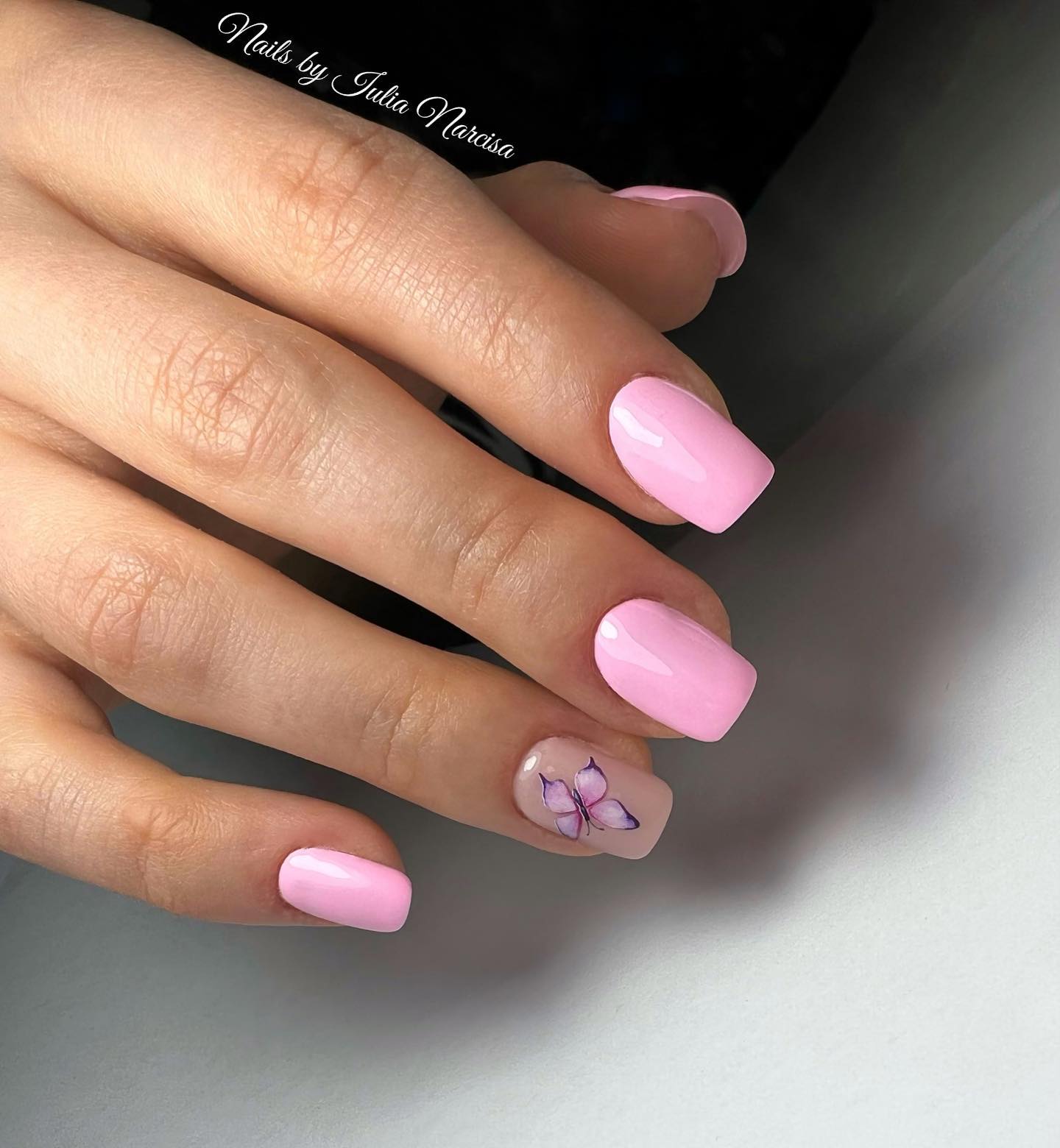 If you want to have a chic and classy look with nail stickers, you can use a pinky butterfly sticker like this.