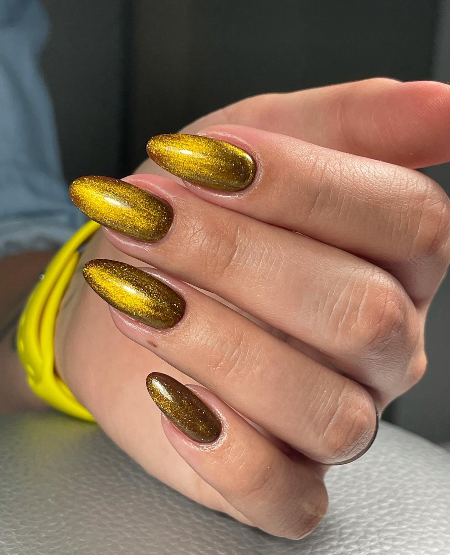 Dark yellow cat eye nails are here for you to rock your nails. These nails can be chosen for fall vibes, too. Let's have fun with your yellow nails.