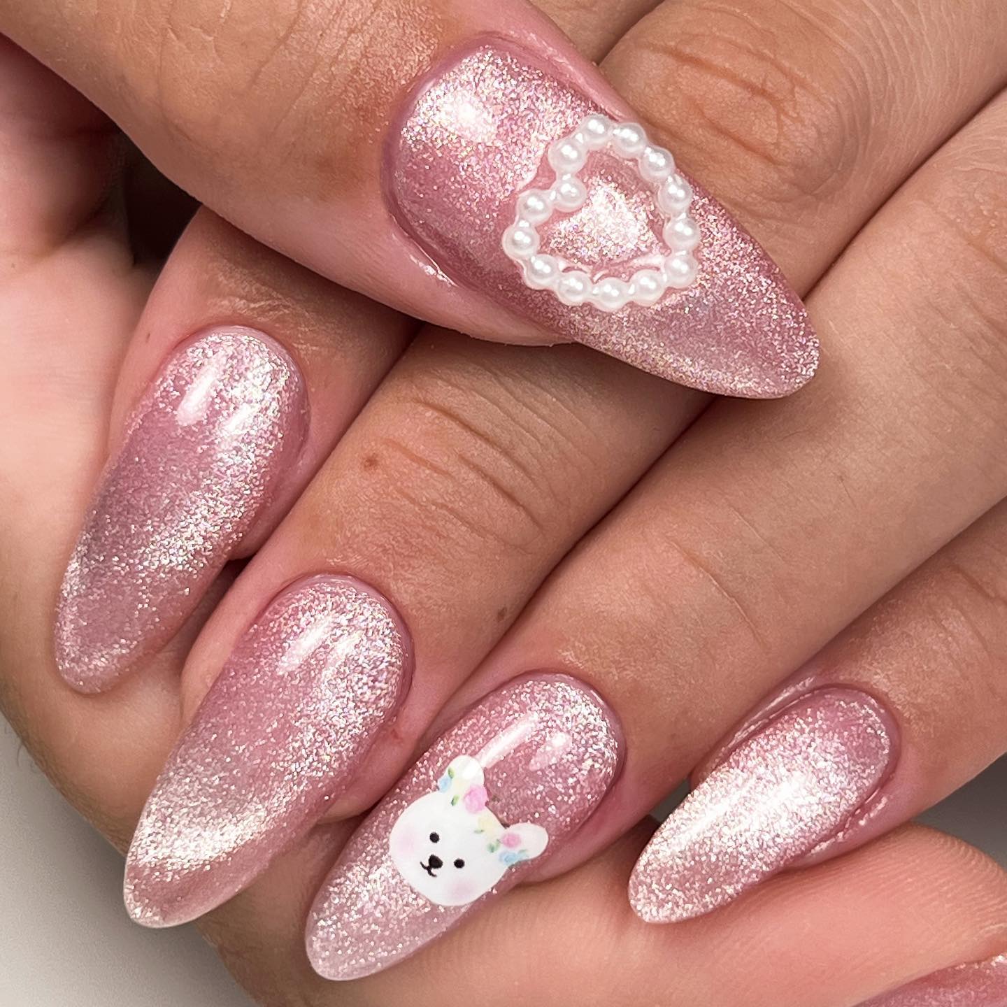 This soft pink cat eye nail art is for those who can't give up applying a pink nail polish. Go for it.