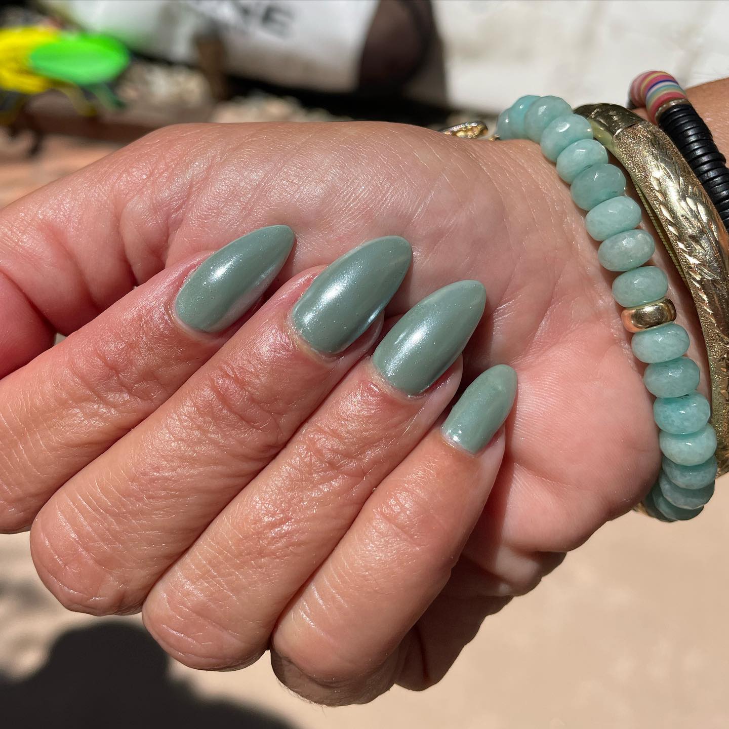 Sage green chrome is a pretty summer look. If you want to match your nails with your bracelet, the one above is a great idea.