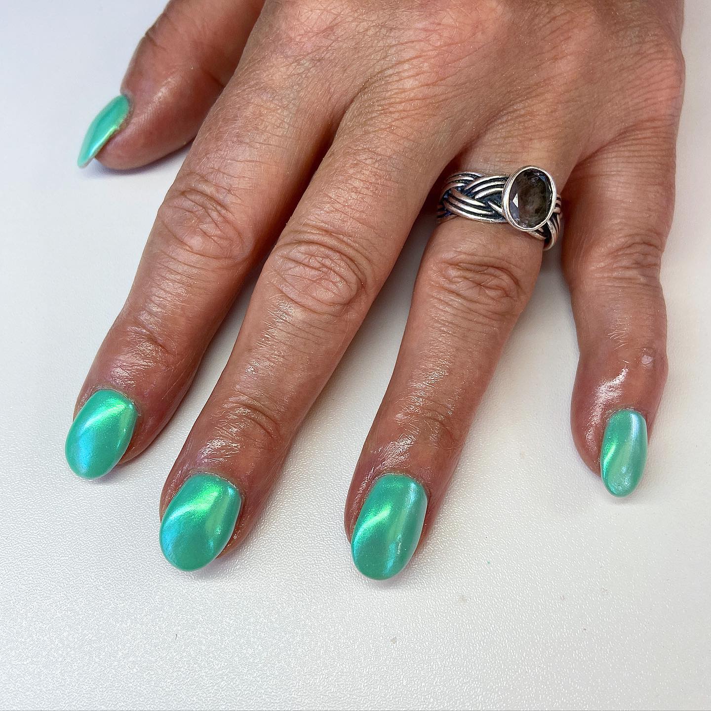 It is amazing how the iridescent powder gives the green nail polish a chrome effect. Go for it if you like this shade of green.