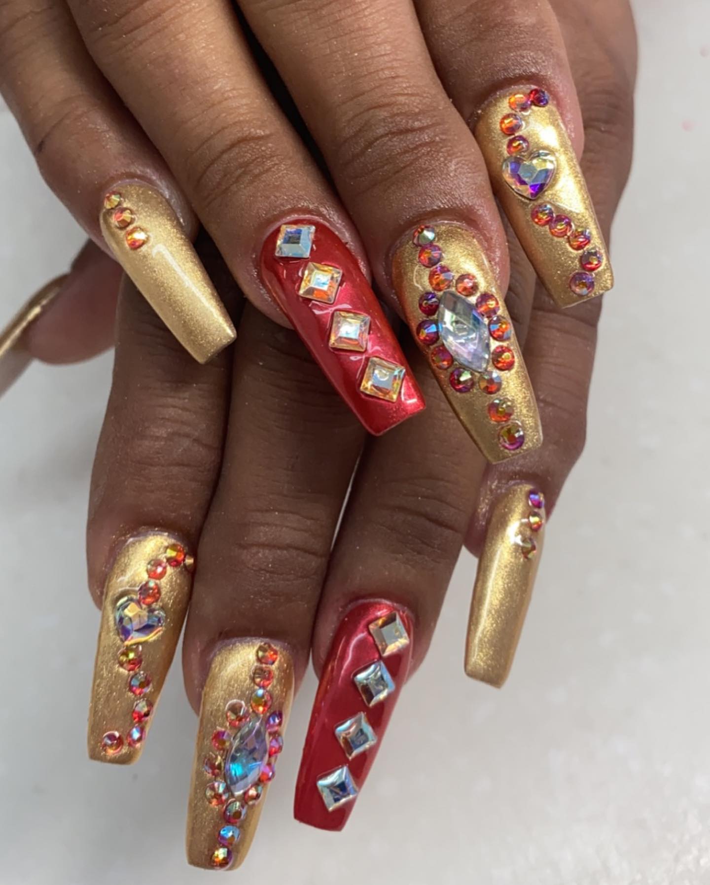 If you like very detailed nail arts, I mean lots of shiny stones, this nail idea is for you. These stones look great on the top of gold and red chrome nails.