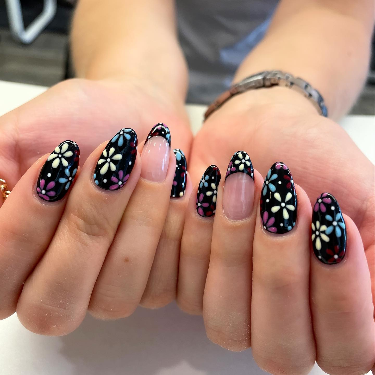 On a black nail polish, your little colorful daisies will shine out. Give it a shot if you like darker tones of nails.