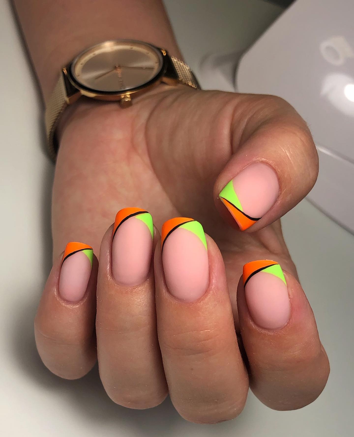  Here is an another idea for French manicure. A matte nail polish with ornage and green neon tips are ready to rock your nails.
