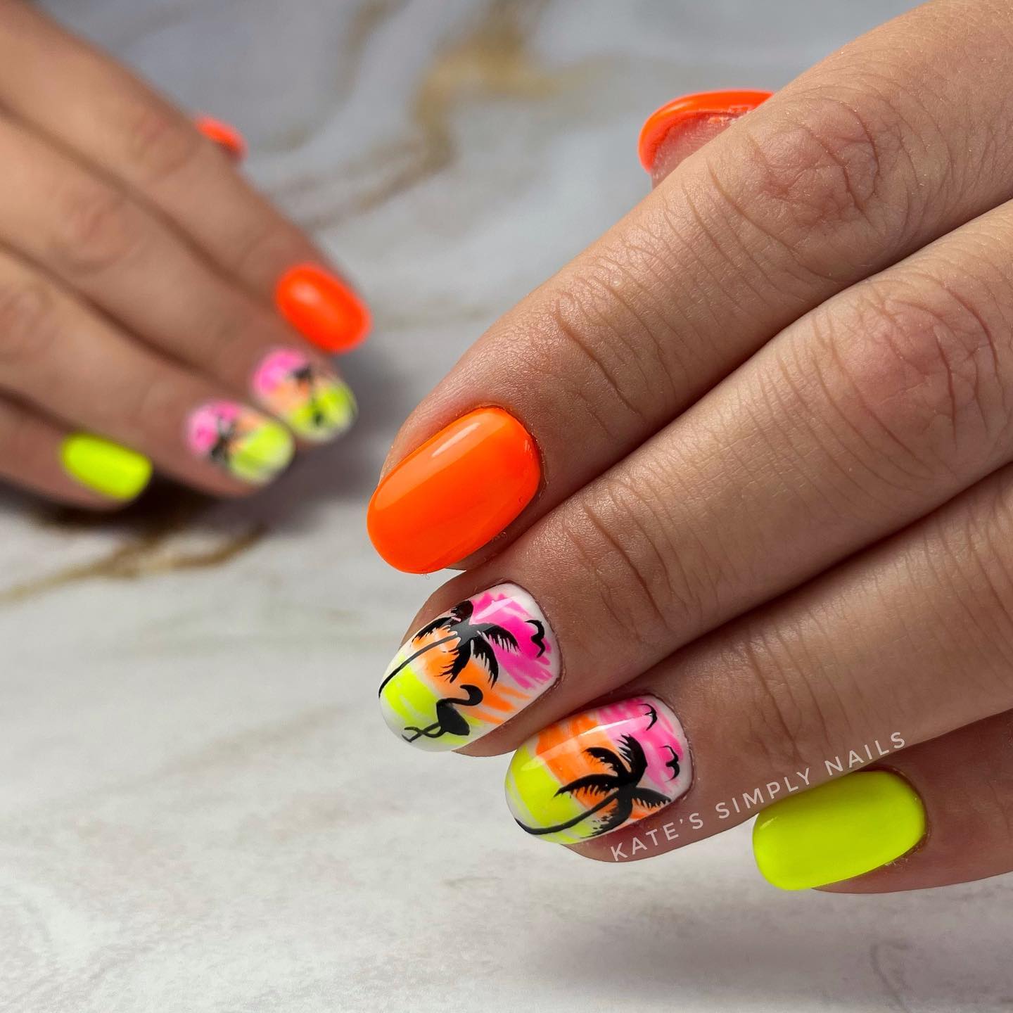 Do you want to get ready for summer with your nails? Then, you should wear colorful nails with a palm and flamingo nail arts.