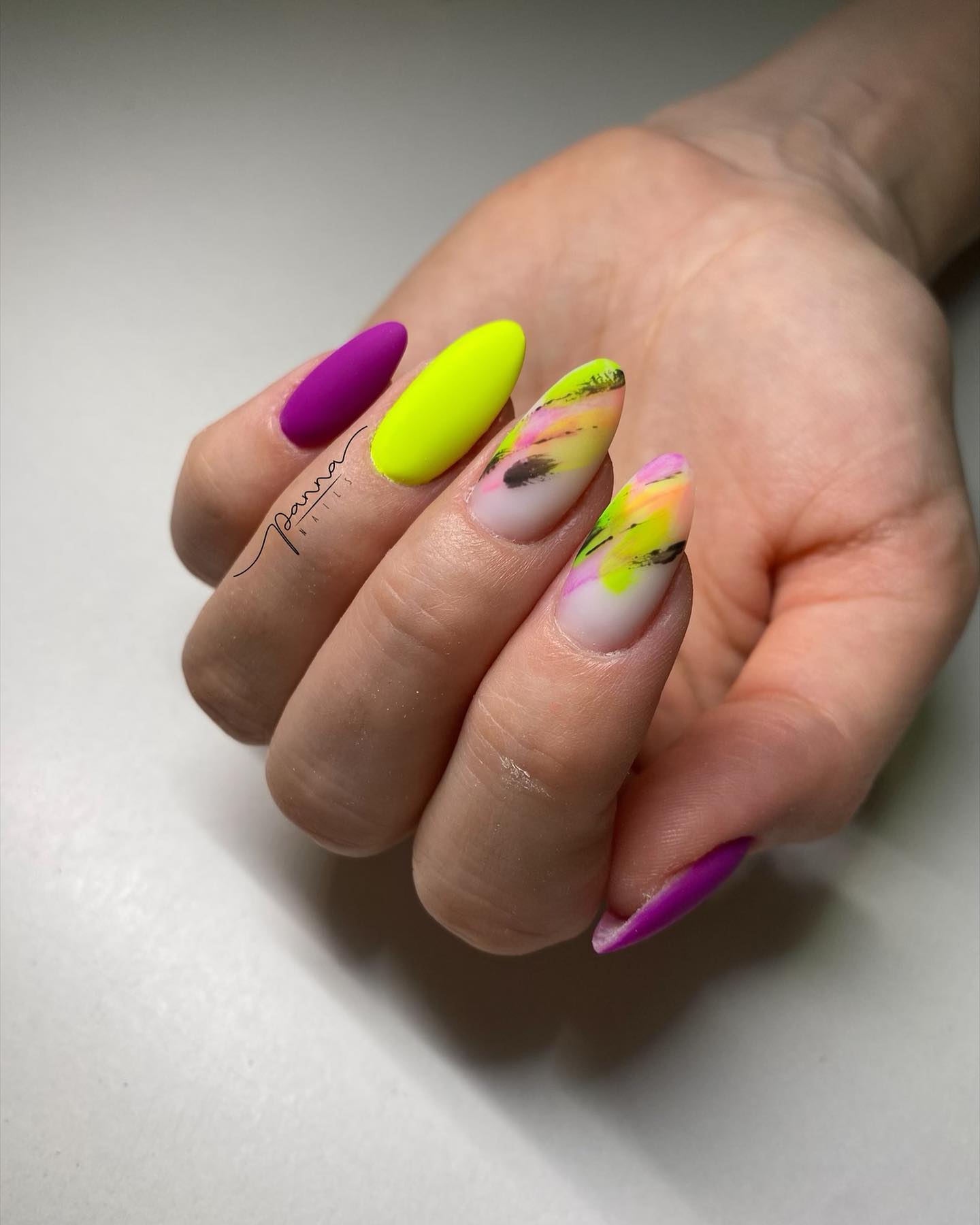 Glossy nail polishes are always nice but what about understated matte nail designs? Try this out if you like purple and yellow neon colors.