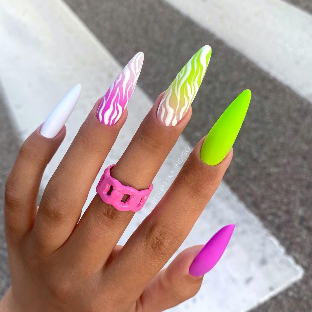 If you have these long acrylic nails, it is crystal clear that you like being different. Then, why don't you use this neon nail design to be more different?