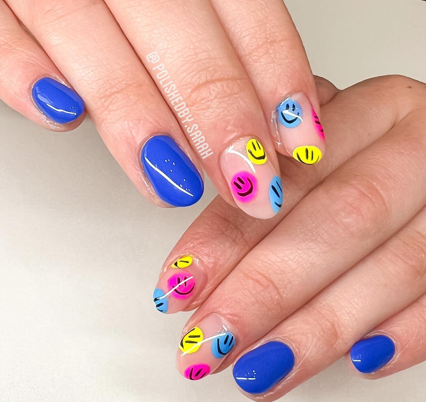 Here is a fun nail design idea for neon nails. Everyone will realize your nails with these two colorful smiley face accents.