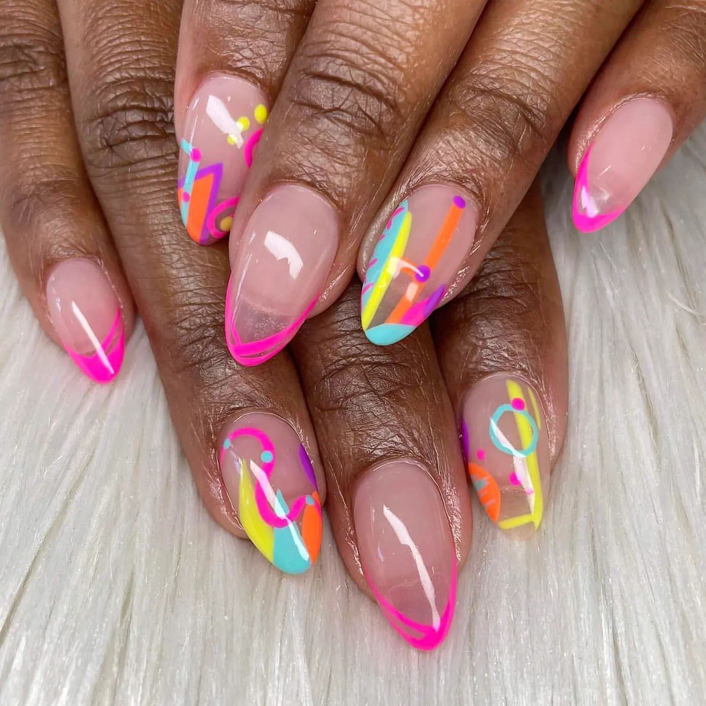 Some random lines and shapes can take your almond nails to a whole different level, especially when neon colors are used in this design.