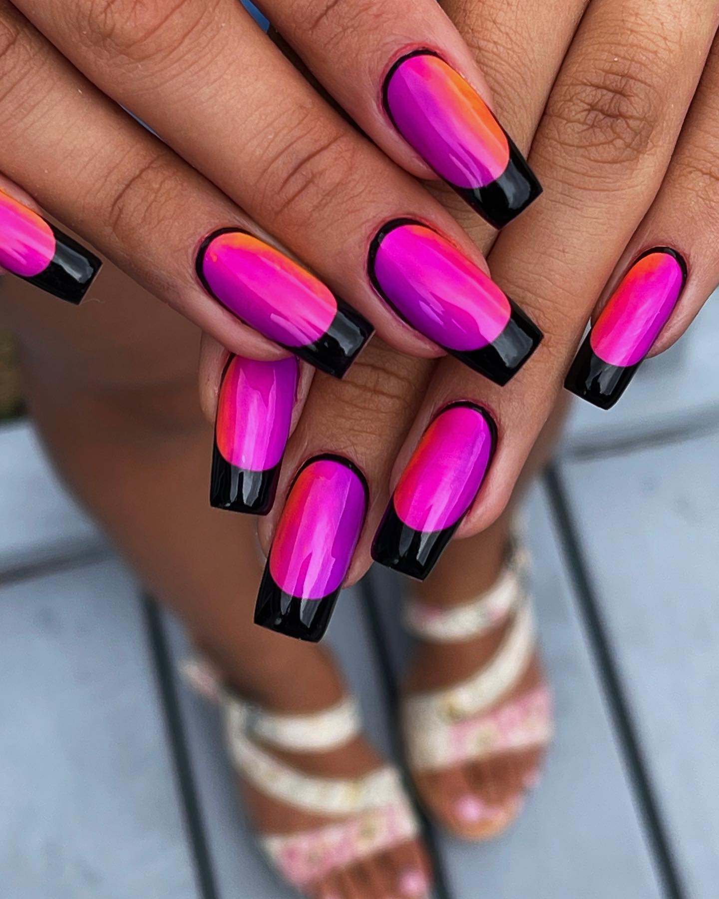 Have you ever seen a cooler framed nail design like this? Purple and orange shaded nails look amazing when they are framed with black.