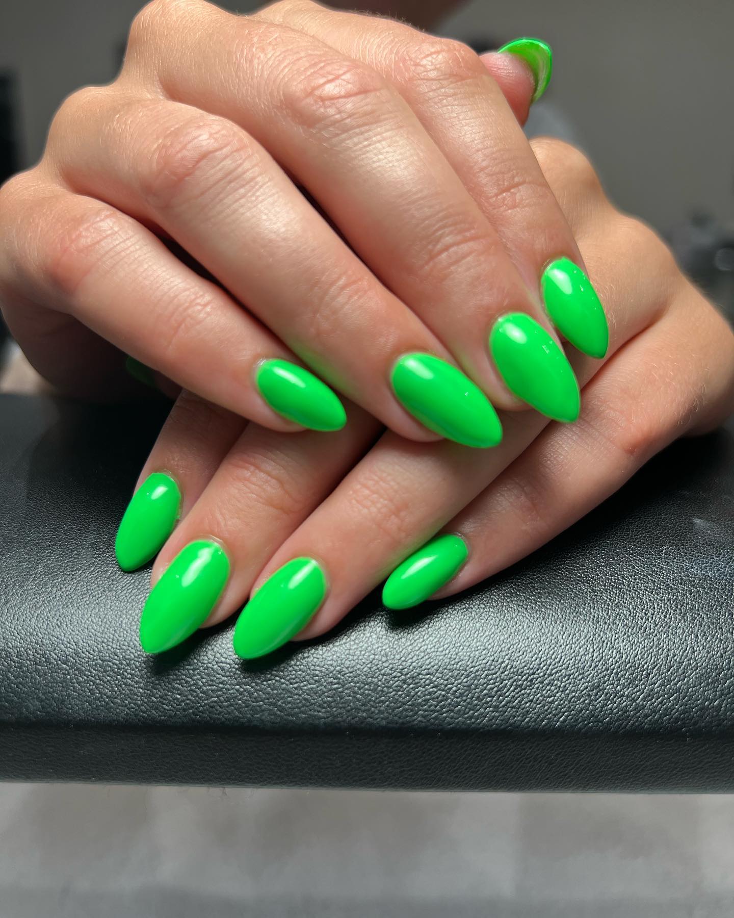 Medium-length almond nails are beautiful and we all agree on that, right? How about applying a neon green nail polish on them?