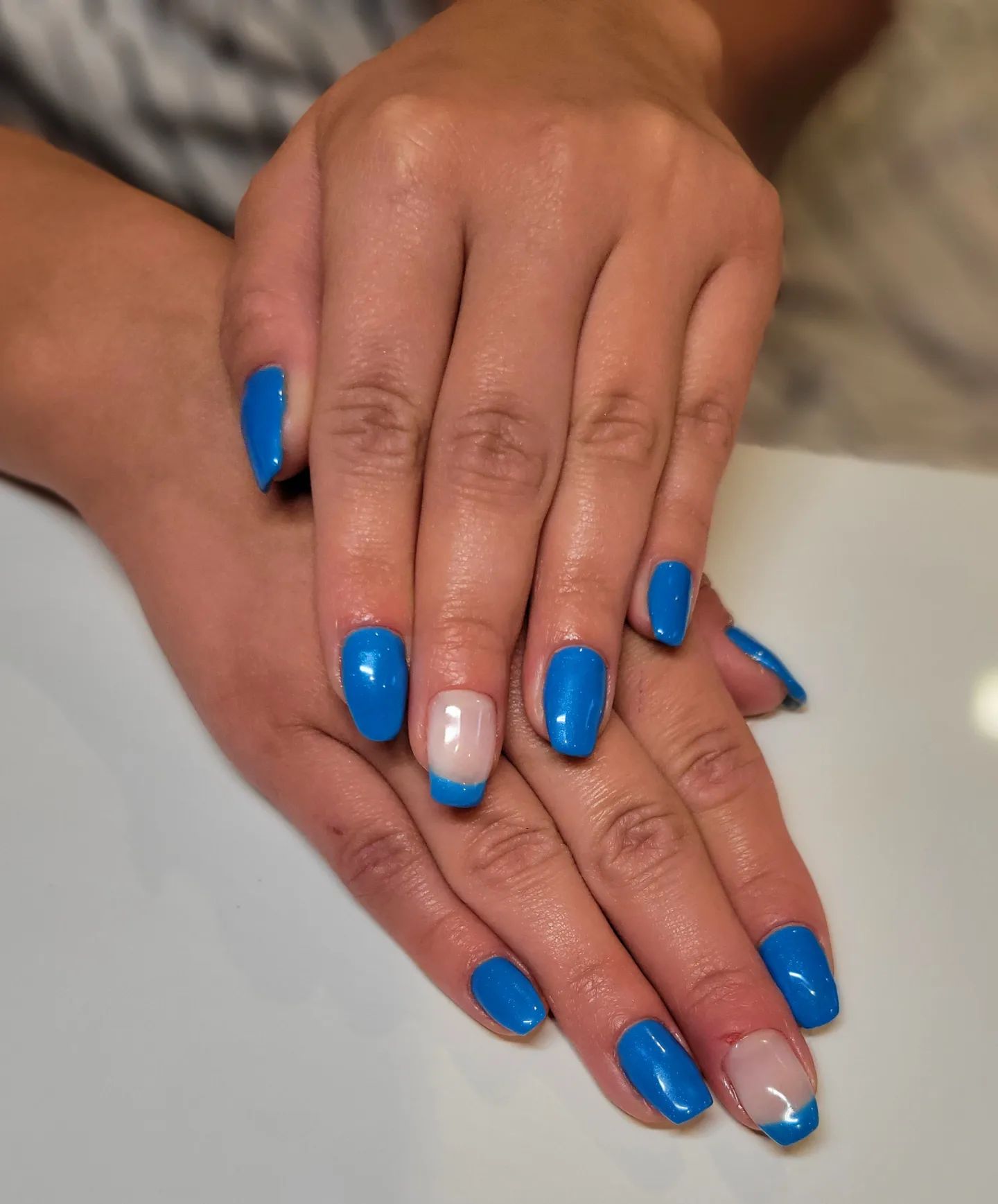  Blue is taken to a new level when neon version of it is used. Your medium-length blue neon nails will look amazing with French accents.