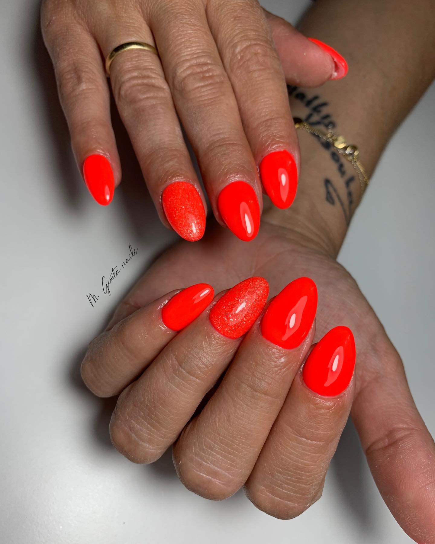  For those who can't give up having almond nails get ready to shine. Neon orange color when combined with almond nails will be fabulous.