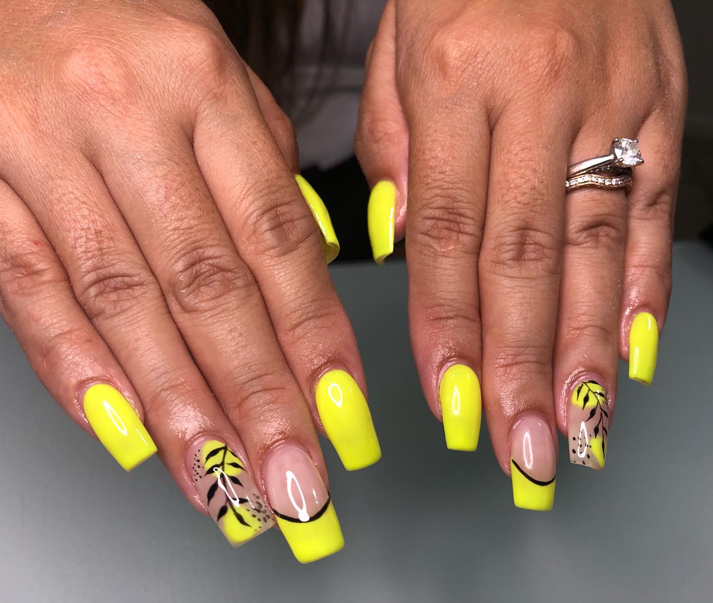 This warm yellow neon nails look great with accent nails. French tips and leaves nail arts will give a different energy.