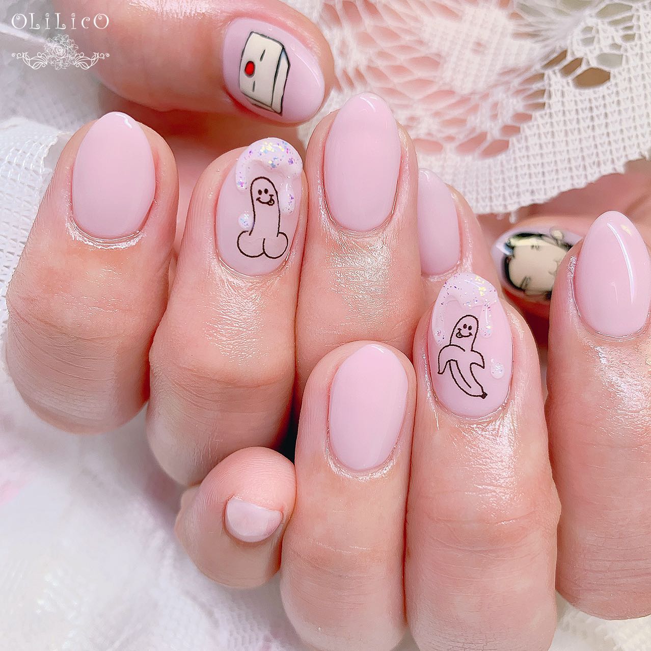 Cute little bananas on nude nails look nice. Plus, as you see above the penis, there are some glitters that emphasize something.